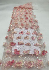 New hand-embroidered floral designs with beads and sequins, elegant women's evening dresses, blouses, strapless gowns, and bead-embellished fabric.