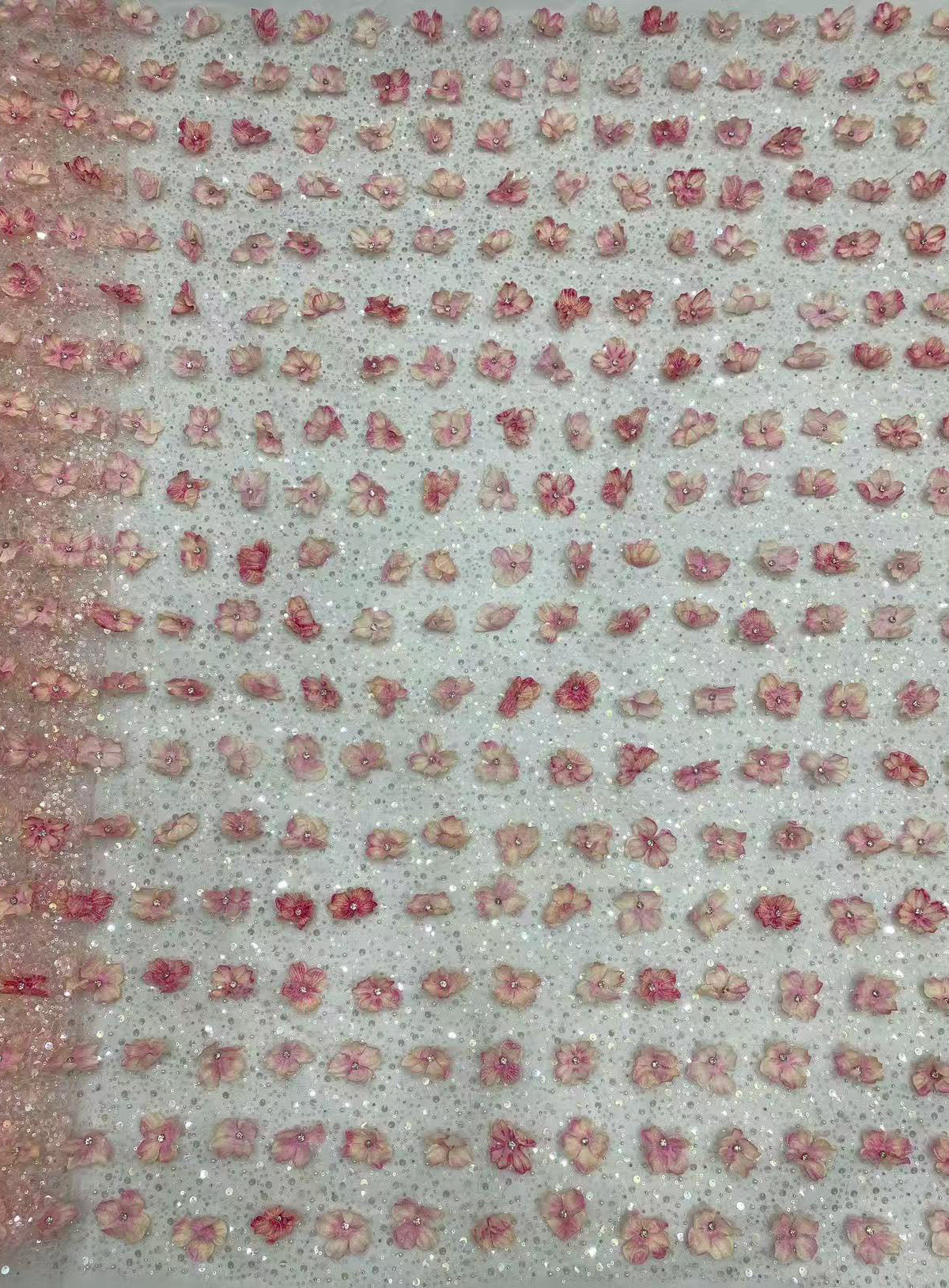 New hand-embroidered floral designs with beads and sequins, elegant women's evening dresses, blouses, strapless gowns, and bead-embellished fabric.