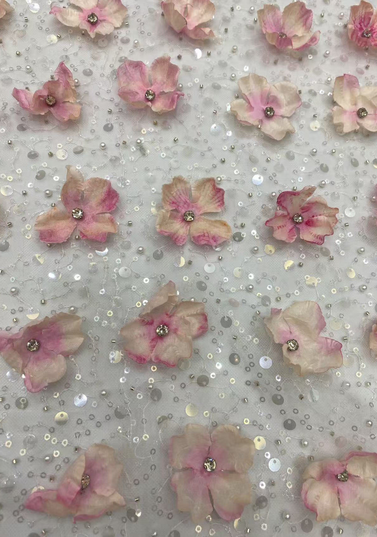 New hand-embroidered floral designs with beads and sequins, elegant women's evening dresses, blouses, strapless gowns, and bead-embellished fabric.